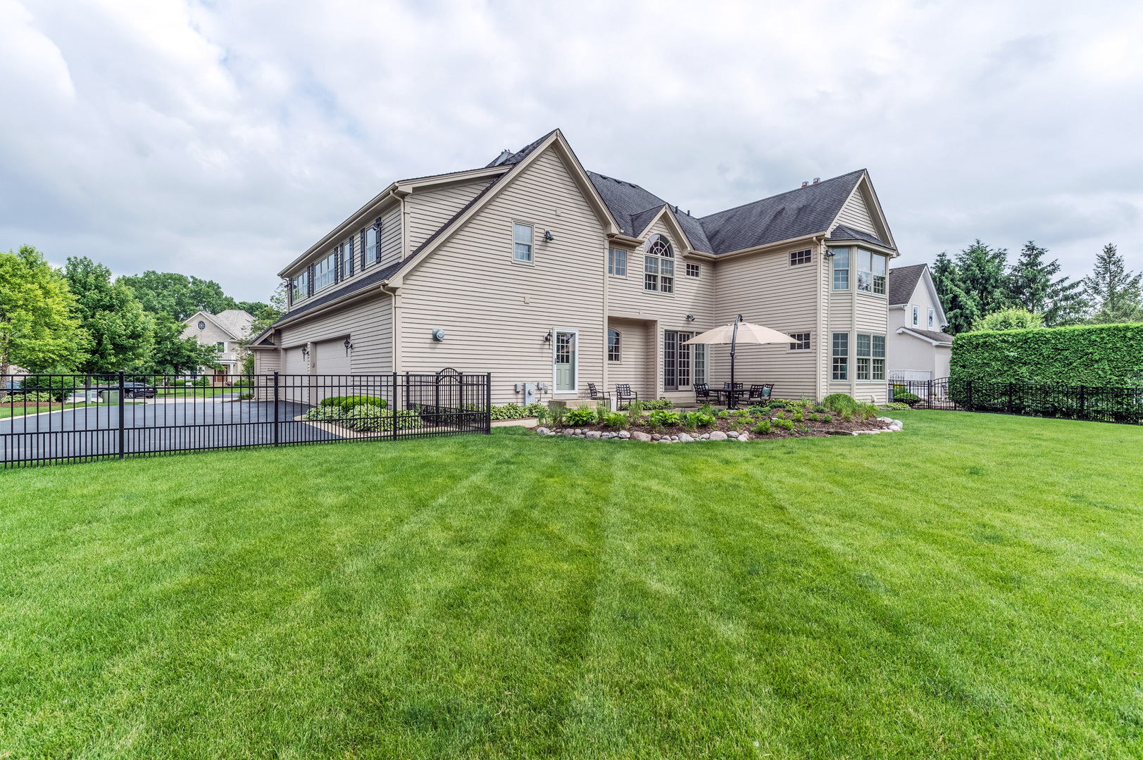 1009 Sutton Place St. Charles, IL 60174 - Photo 37 of 41 a front view of house with yard and green space