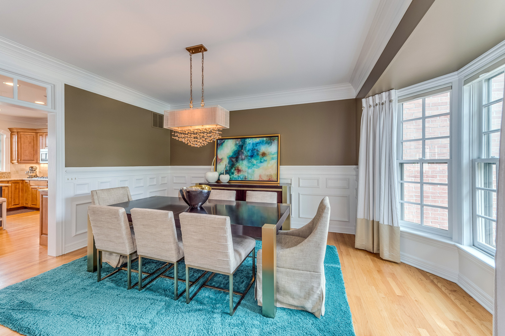 1009 Sutton Place St. Charles, IL 60174 - Photo 5 of 41 a dining room with furniture a chandelier and wooden floor