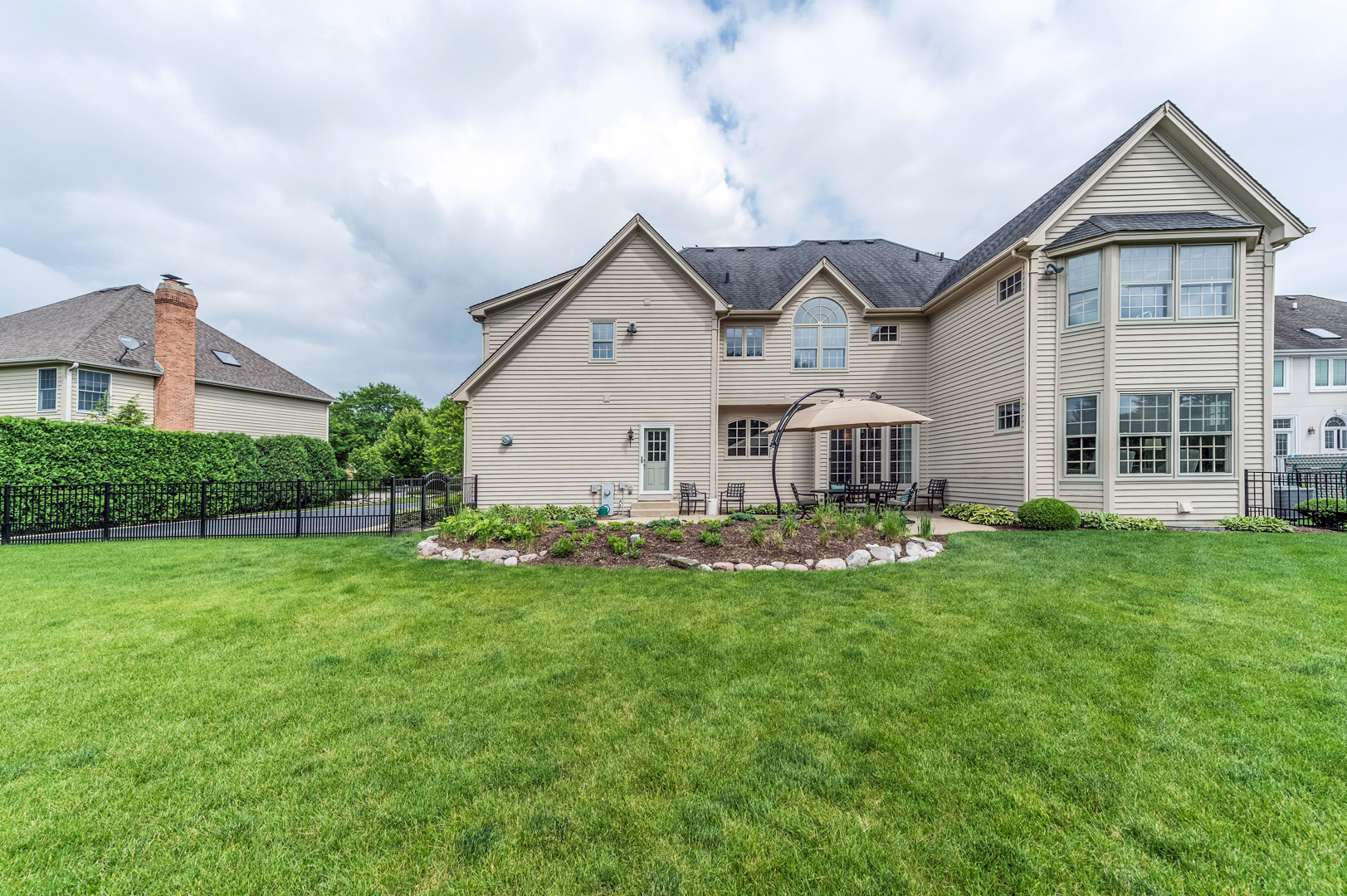 1009 Sutton Place St. Charles, IL 60174 - Photo 41 of 41 a view of a house with a big yard and large trees