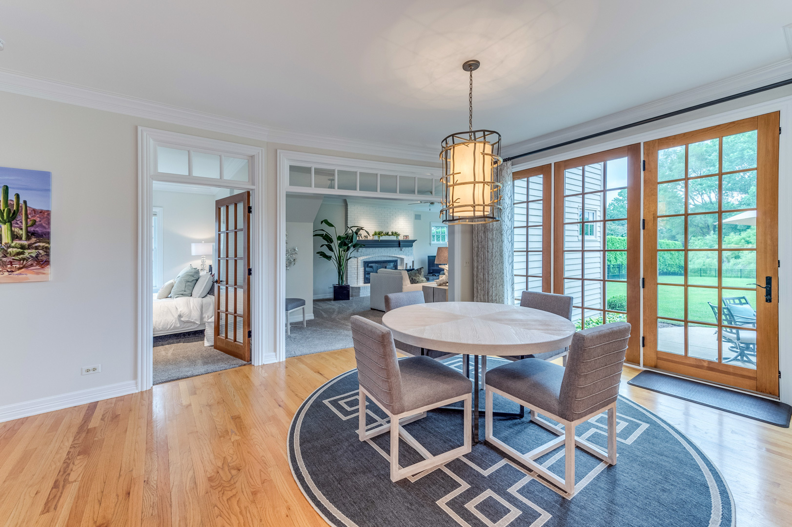 1009 Sutton Place St. Charles, IL 60174 - Photo 9 of 41 a dining room with furniture a chandelier and wooden floor