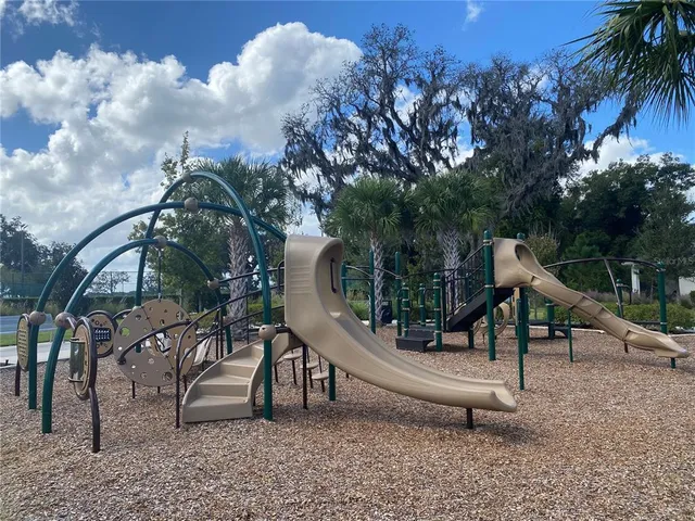 a view of a park with iron fence