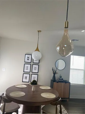 a view of a dining room with furniture