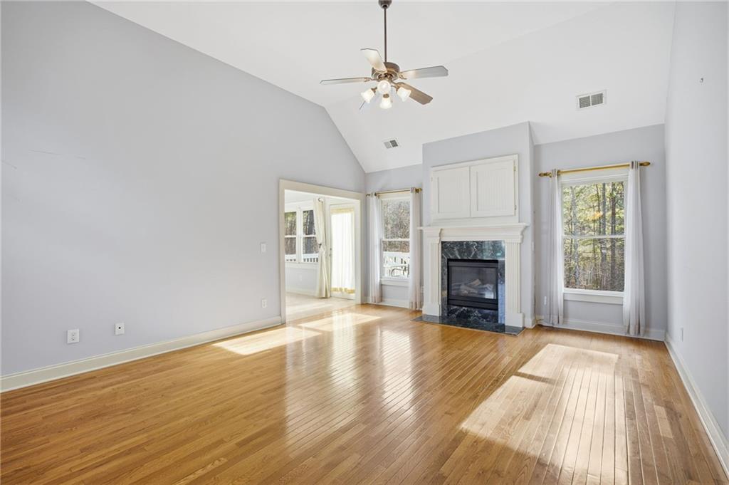 152 Jefferson Drive Dallas, GA 30132 - Photo 11 of 47 a view of an empty room with a fireplace and a window