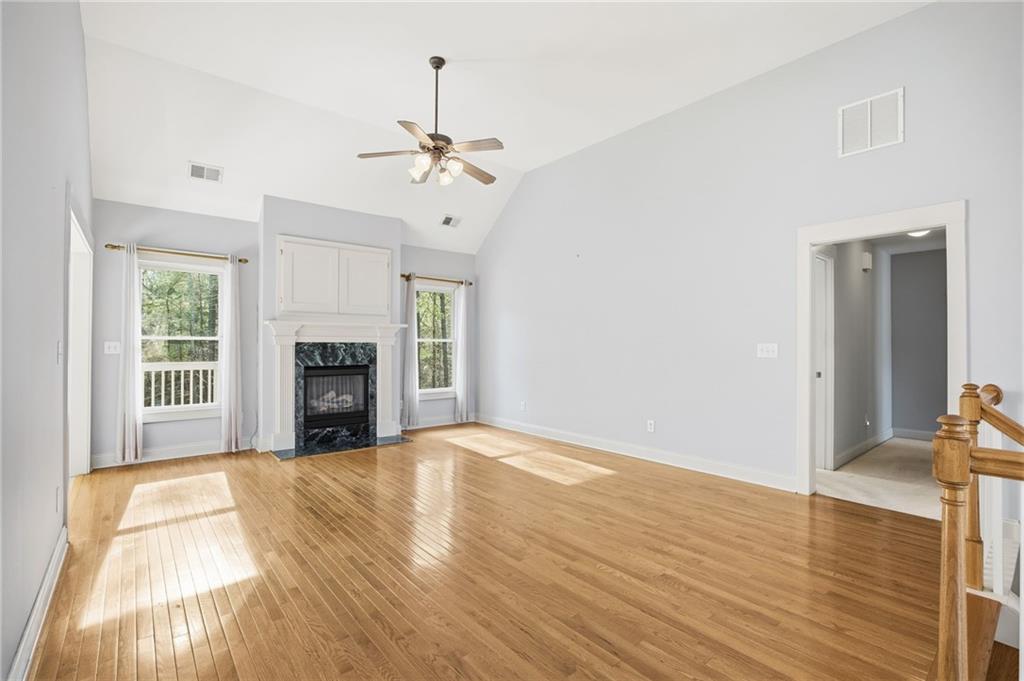 152 Jefferson Drive Dallas, GA 30132 - Photo 12 of 47 a view of empty room with wooden floor and fireplace