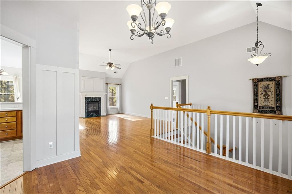 152 Jefferson Drive Dallas, GA 30132 - Photo 14 of 47 a view of a livingroom with wooden floor and a ceiling fan