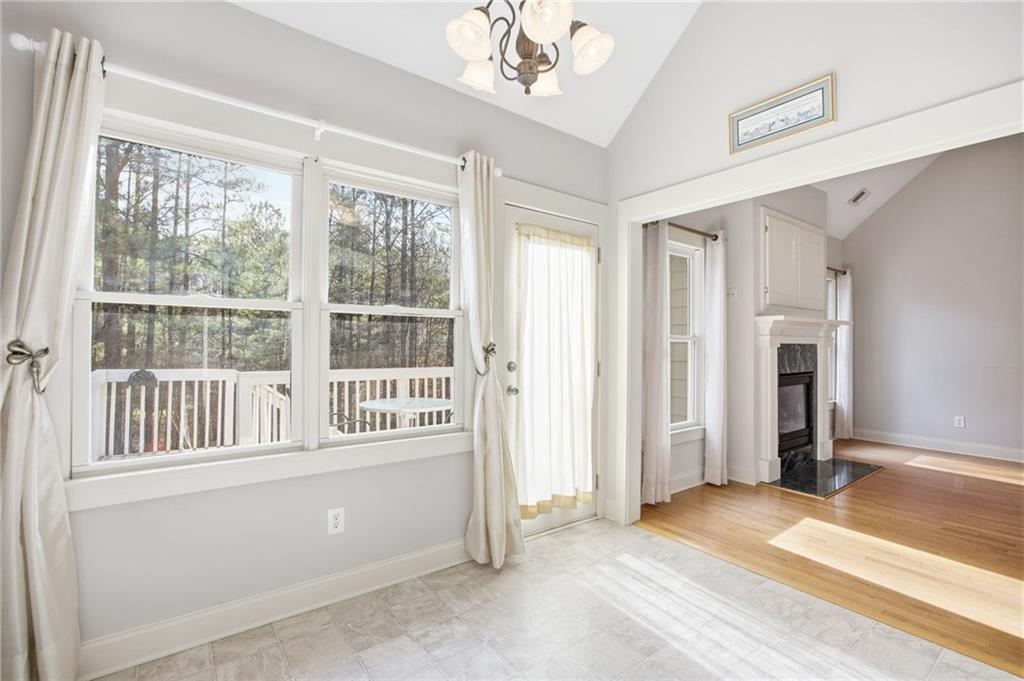 152 Jefferson Drive Dallas, GA 30132 - Photo 16 of 47 an empty room with a fireplace and windows
