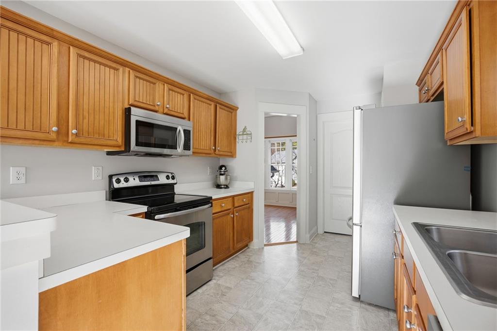 152 Jefferson Drive Dallas, GA 30132 - Photo 18 of 47 a kitchen with stainless steel appliances a stove a sink and a refrigerator