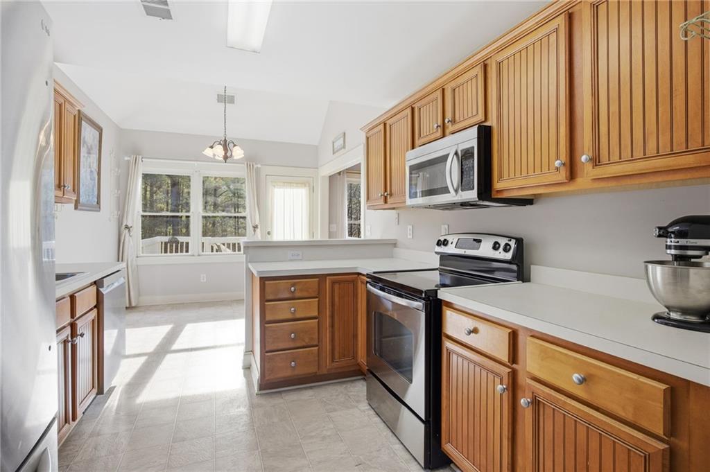 152 Jefferson Drive Dallas, GA 30132 - Photo 20 of 47 a kitchen with stainless steel appliances granite countertop a sink stove and cabinets