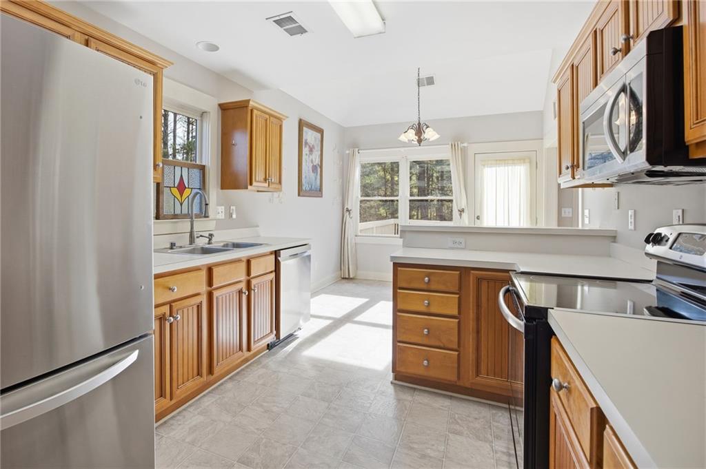 152 Jefferson Drive Dallas, GA 30132 - Photo 21 of 47 a kitchen with stainless steel appliances granite countertop a sink stove and refrigerator
