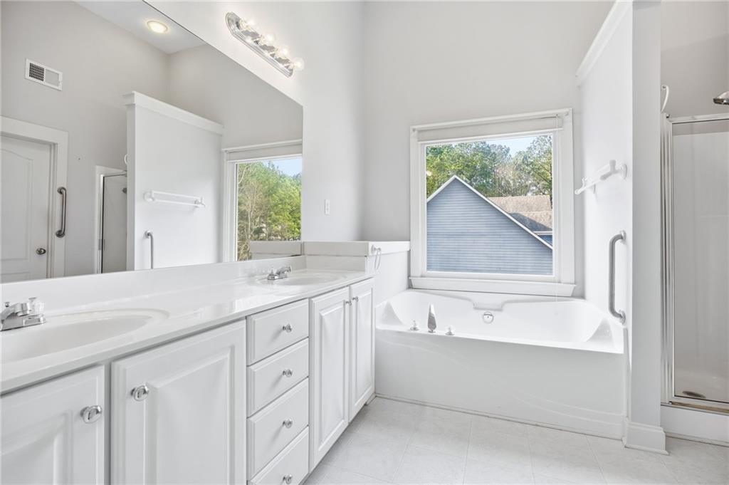 152 Jefferson Drive Dallas, GA 30132 - Photo 26 of 47 a bathroom with a granite countertop sink mirror and a