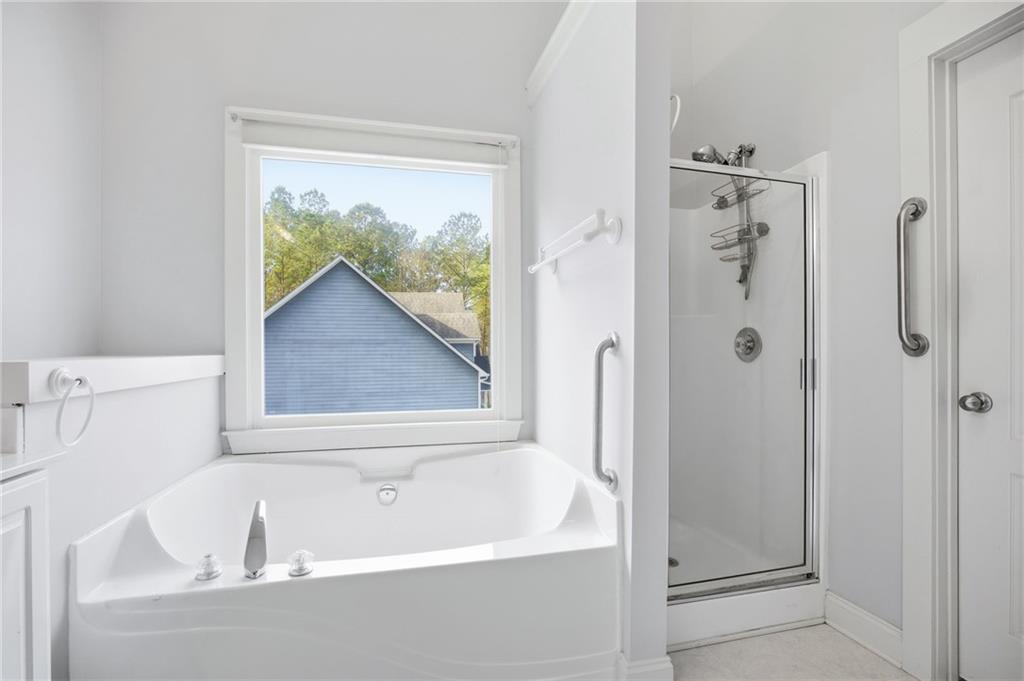 152 Jefferson Drive Dallas, GA 30132 - Photo 27 of 47 a white bath tub sitting next to a shower