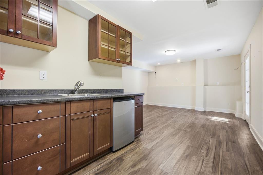 152 Jefferson Drive Dallas, GA 30132 - Photo 33 of 47 a kitchen with granite countertop a sink and wooden floor