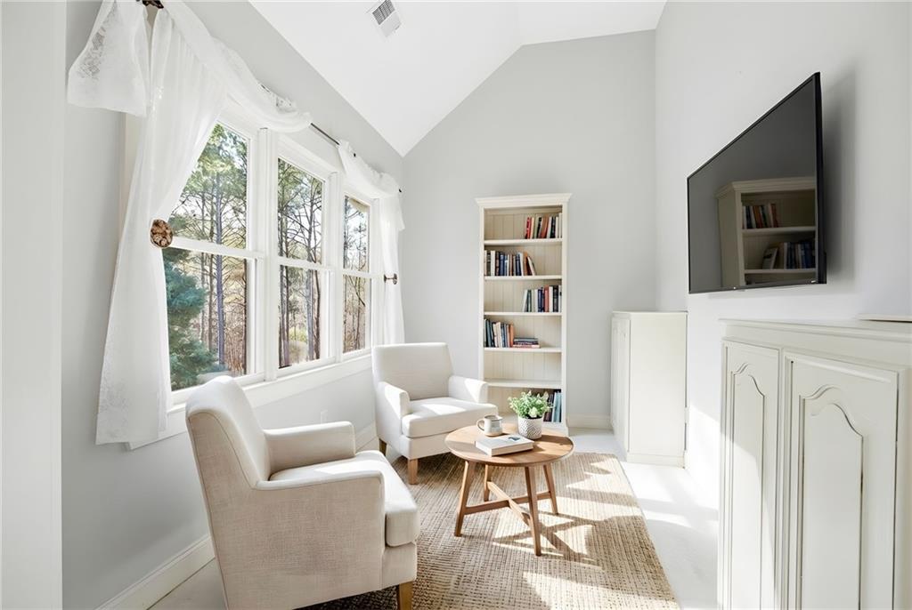 152 Jefferson Drive Dallas, GA 30132 - Photo 5 of 47 a living room with furniture a flat screen tv and a large window