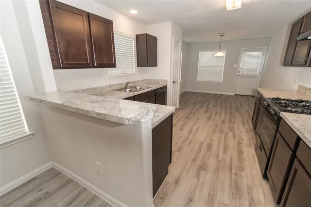an empty room with wooden floor