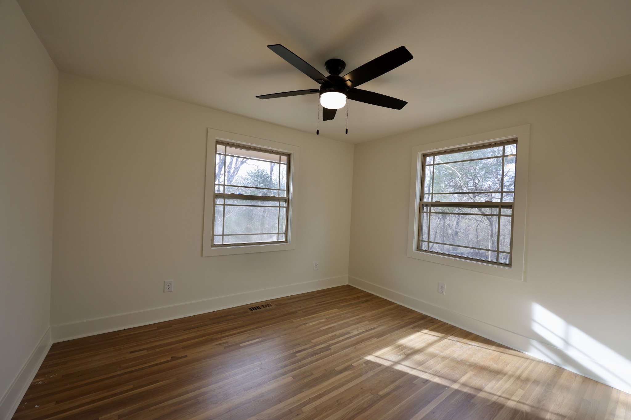 4392 Ashland City Road Clarksville, TN 37043 - Photo 15 of 19 a view of an empty room with wooden floor and a window