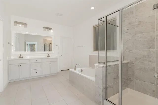 a spacious bathroom with a shower sink mirror and bathtub