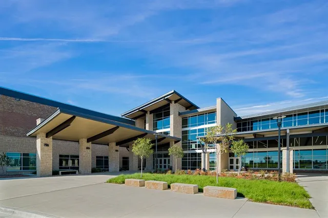 a balcony with table and chairs