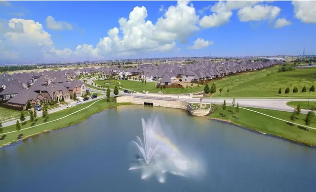 a view of a living room and kitchen with a large window
