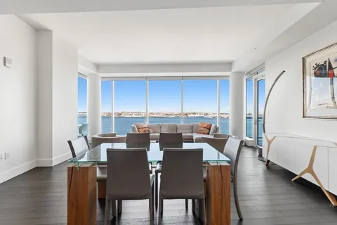 a kitchen with stainless steel appliances a sink and a refrigerator