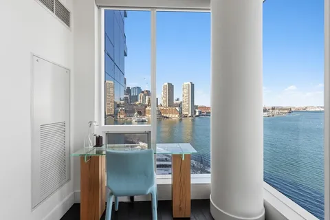 a view of a lake from a balcony