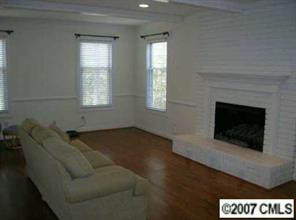3227 Gray Moss Road Charlotte, NC 28270 - Photo 2 of 8 a living room with furniture and a fireplace