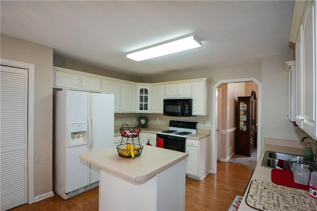 36 Austin Trail Douglasville, GA 30134 - Photo 11 of 43 a kitchen with refrigerator and cabinets