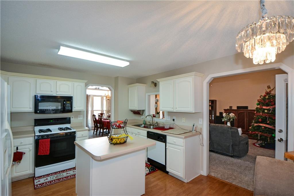 36 Austin Trail Douglasville, GA 30134 - Photo 12 of 43 a kitchen that has a sink and a stove in it