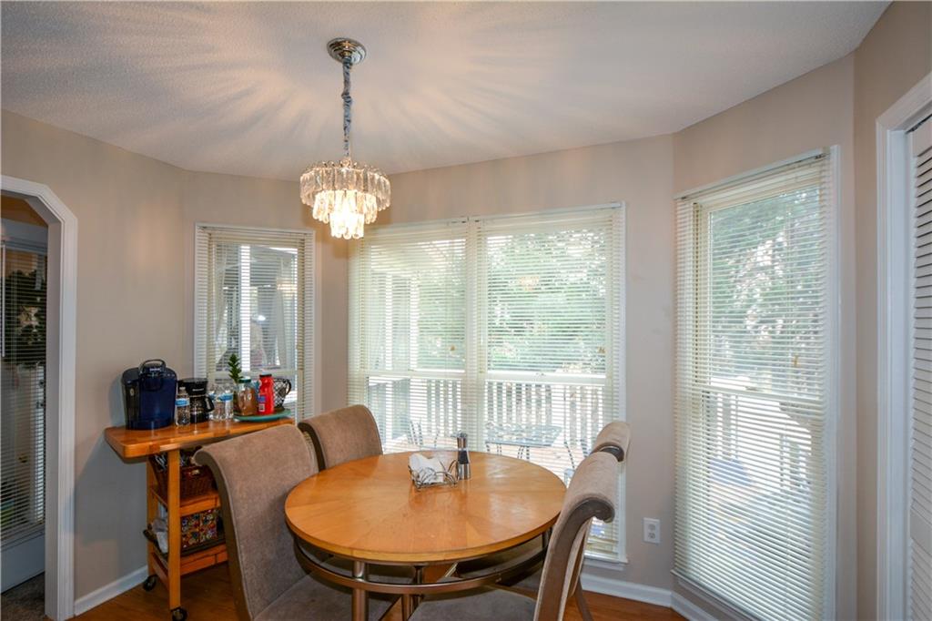 36 Austin Trail Douglasville, GA 30134 - Photo 14 of 43 a dining room with furniture a chandelier and wooden floor