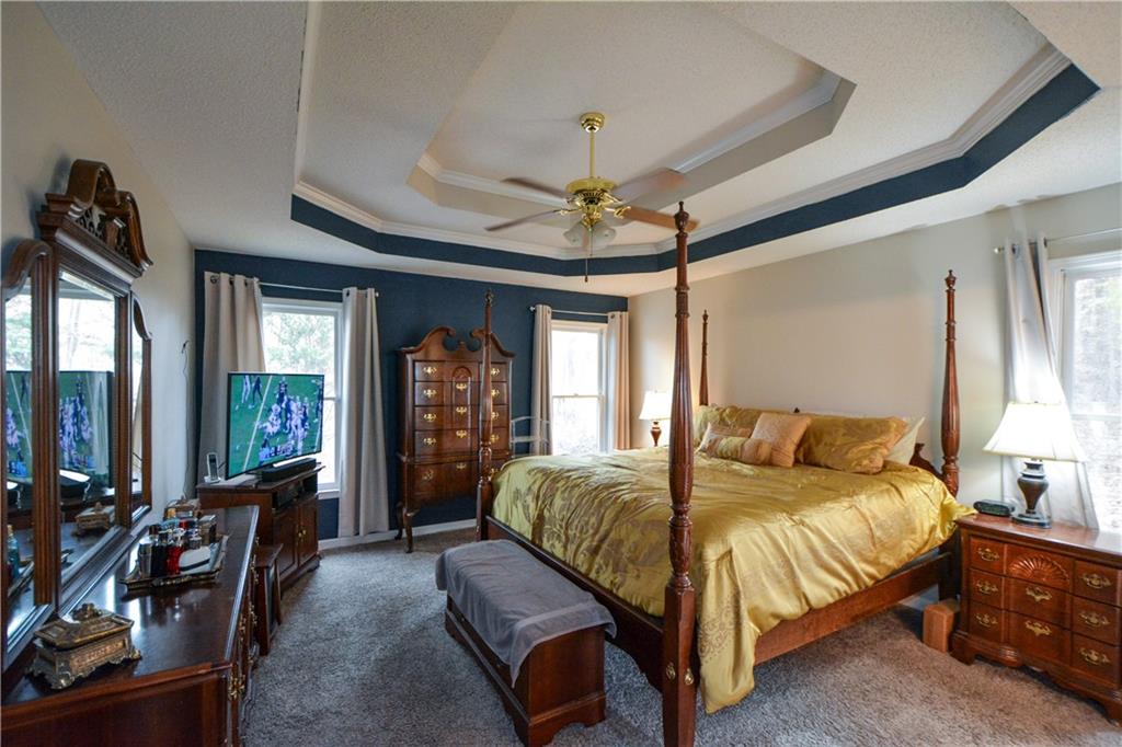 36 Austin Trail Douglasville, GA 30134 - Photo 19 of 43 a bedroom with a large bed couch and a window