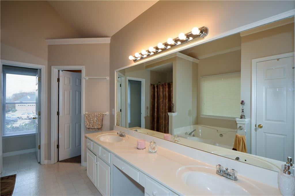 36 Austin Trail Douglasville, GA 30134 - Photo 22 of 43 a spacious bathroom with a double vanity sink and a mirror