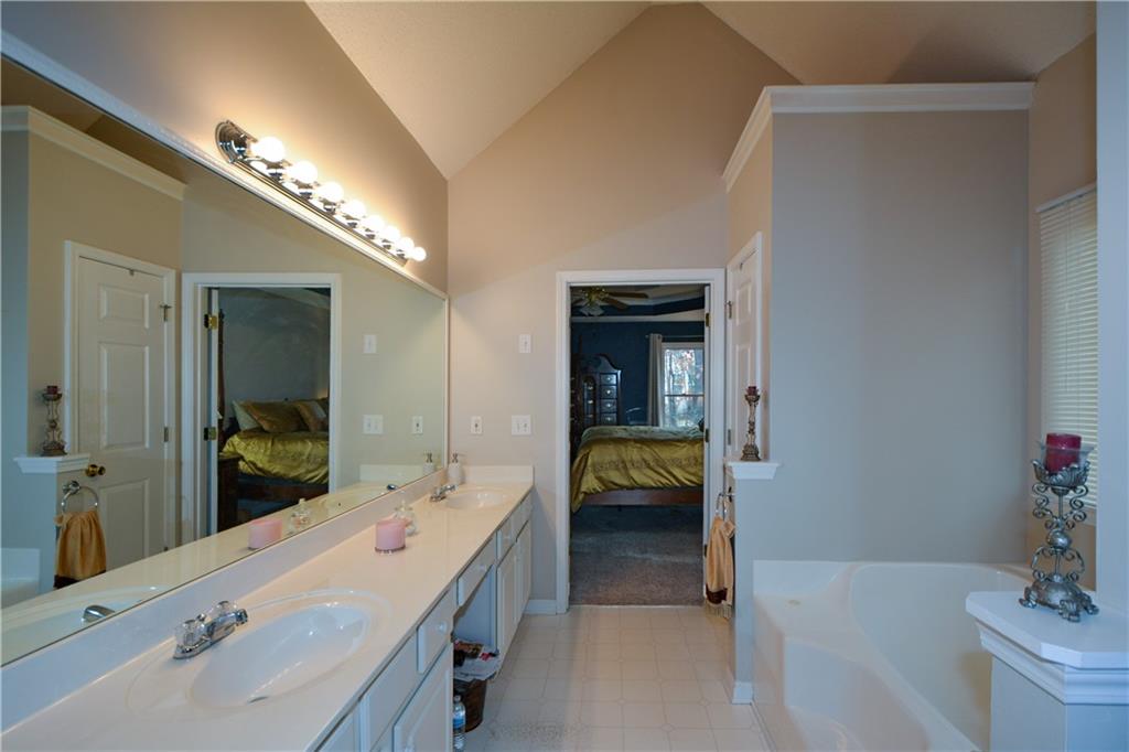 36 Austin Trail Douglasville, GA 30134 - Photo 23 of 43 a en suite bathroom with a sink and a large mirror