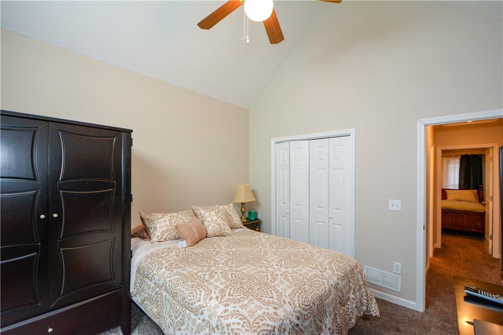 36 Austin Trail Douglasville, GA 30134 - Photo 27 of 43 a bedroom with a bed and a walk in closet