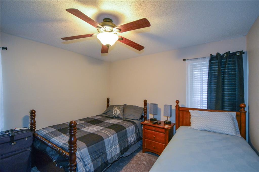 36 Austin Trail Douglasville, GA 30134 - Photo 28 of 43 a bedroom with a bed and wooden floor