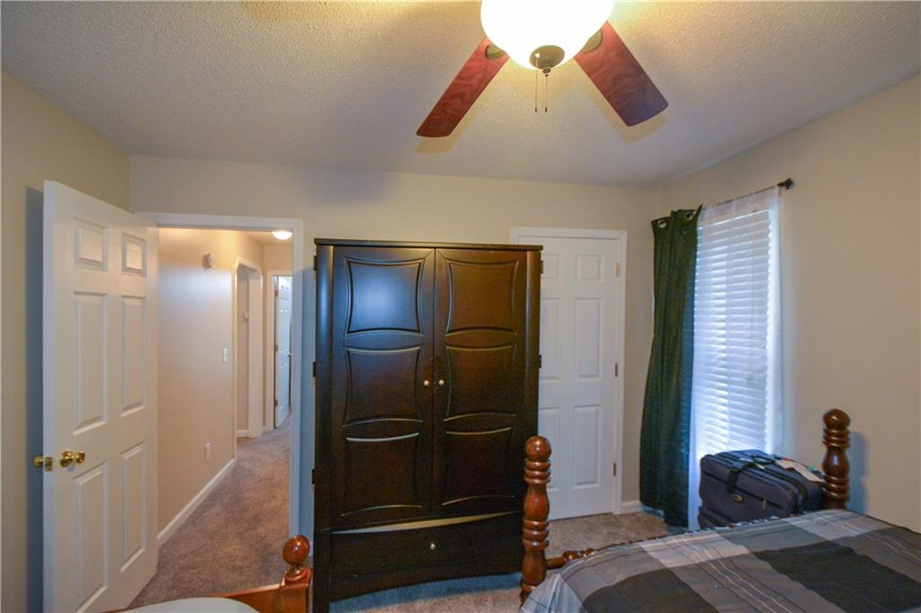 36 Austin Trail Douglasville, GA 30134 - Photo 29 of 43 a bedroom with a bed and a walk in closet