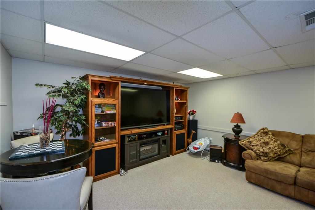 36 Austin Trail Douglasville, GA 30134 - Photo 32 of 43 a living room with furniture and a flat screen tv