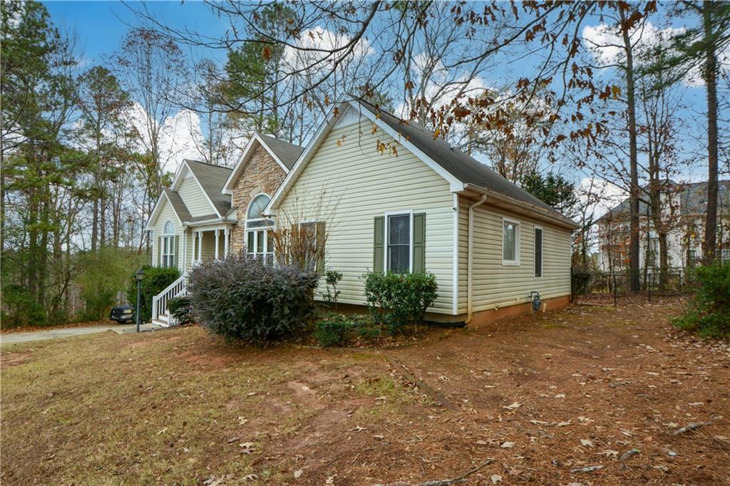 36 Austin Trail Douglasville, GA 30134 - Photo 41 of 43 a view of a house with a yard and potted plants
