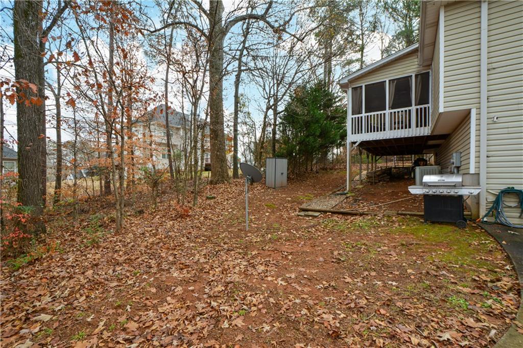 36 Austin Trail Douglasville, GA 30134 - Photo 42 of 43 a backyard of a house with barbeque oven and outdoor seating