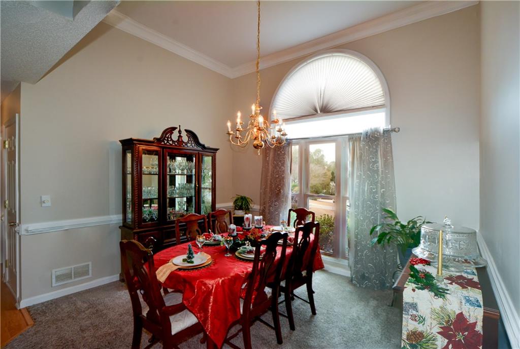 36 Austin Trail Douglasville, GA 30134 - Photo 9 of 43 a view of a dining room with furniture and a chandelier
