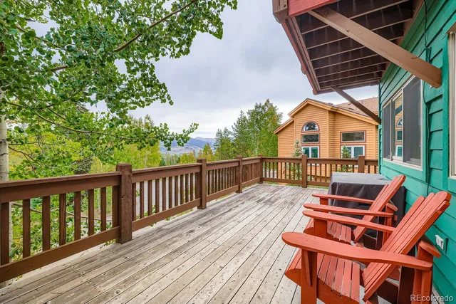 a view of balcony with wooden floor and outdoor seating