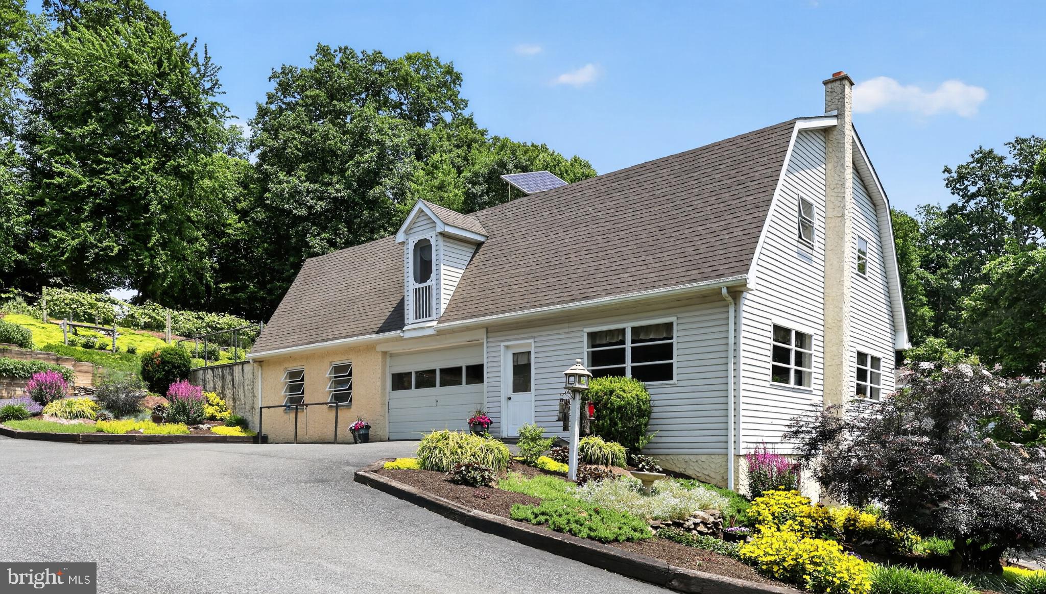 257 Hill Road New Holland, PA 17557 - Photo 44 of 94 Charming home with vibrant landscaping.