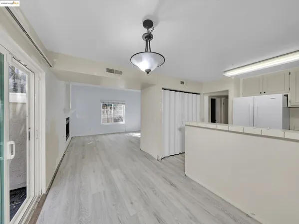 a view of a kitchen with wooden floor