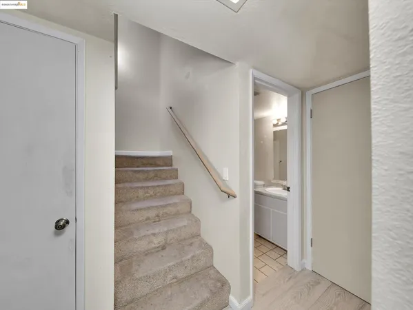 a view of entryway with hallway and stairs