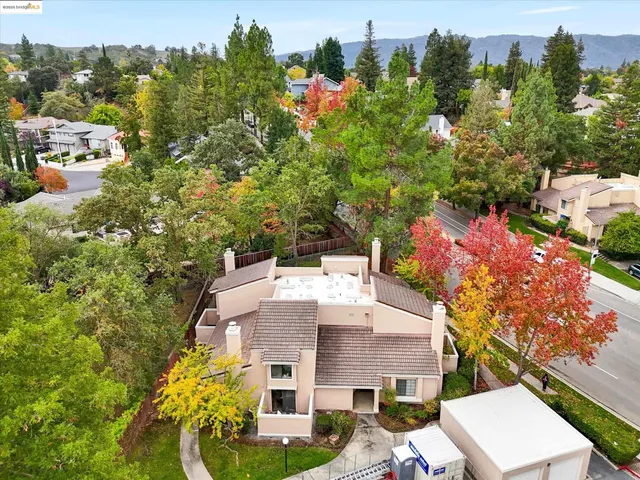 an aerial view of a house with a yard basket ball court and outdoor seating