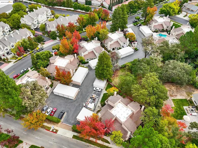 an aerial view of a houses with yard