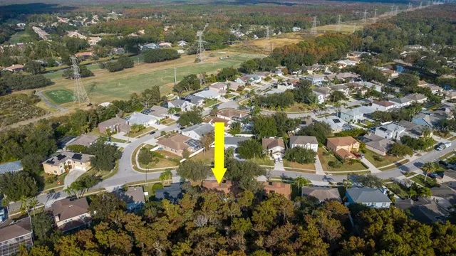 an aerial view of residential house with outdoor space and river