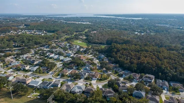 a view of a white house with a yard