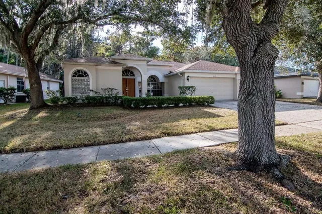 a front view of a house with swimming pool and porch