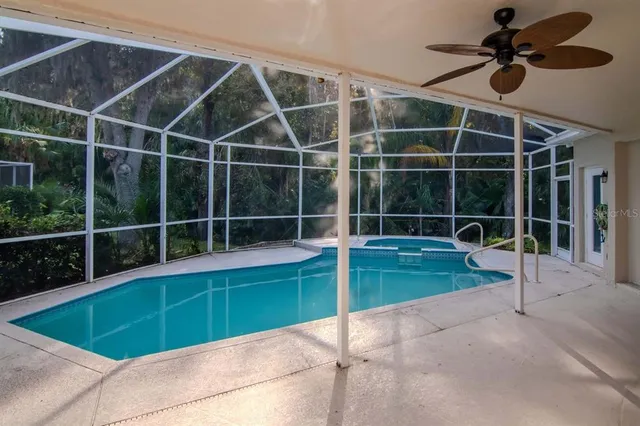 an empty room with windows and outdoor view