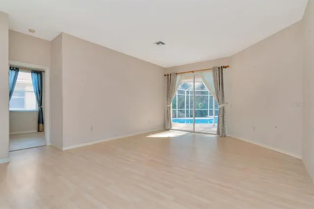 a kitchen with stainless steel appliances granite countertop a sink and a stove top oven