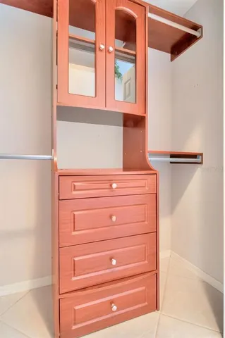 a kitchen with stainless steel appliances granite countertop a sink and dishwasher a stove top oven with white cabinets